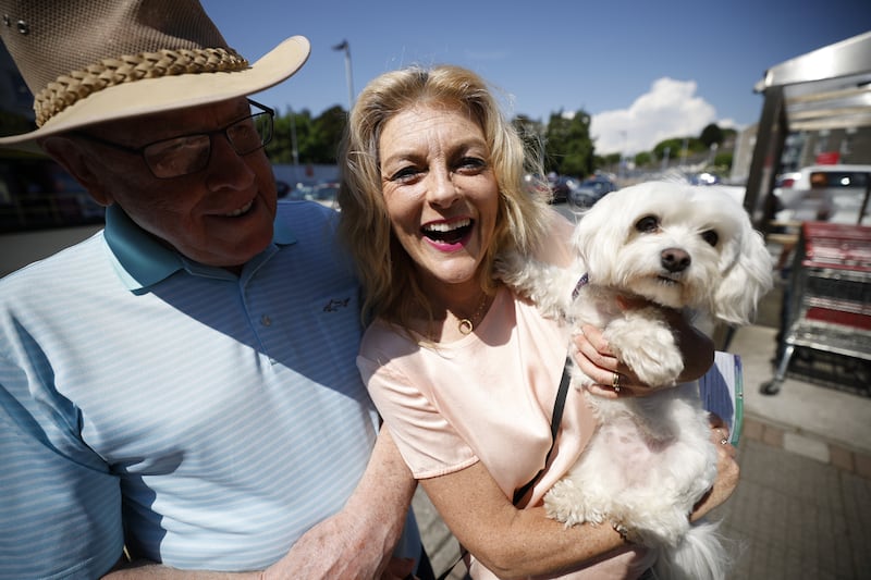 Liam Wynne with Cynthia Ní Mhurchú and Bella the dog during campaigning in Wicklow Town. Photograph Nick Bradshaw for The Irish Times
