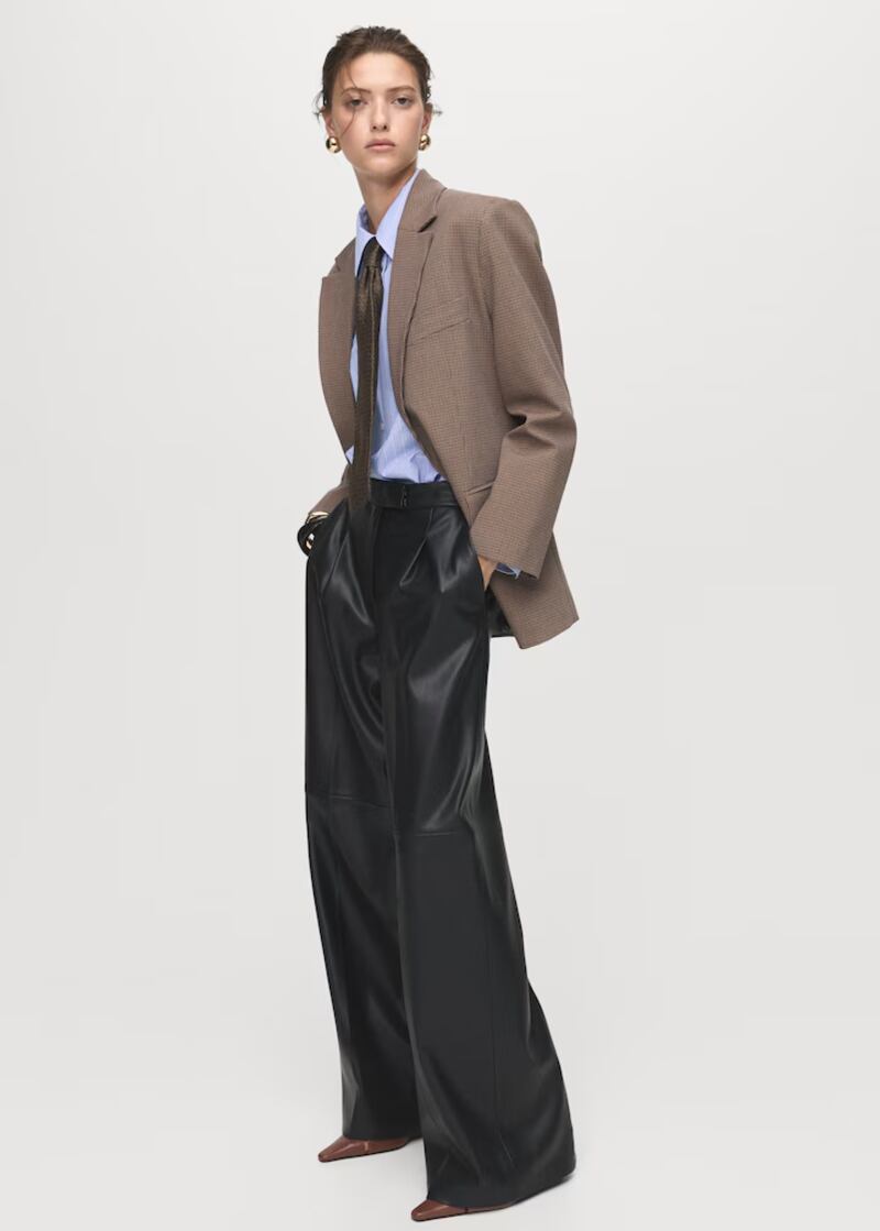 Tailored jacket, €49, blue shirt, €29.99, and black leather effect trousers, €39, from Mango