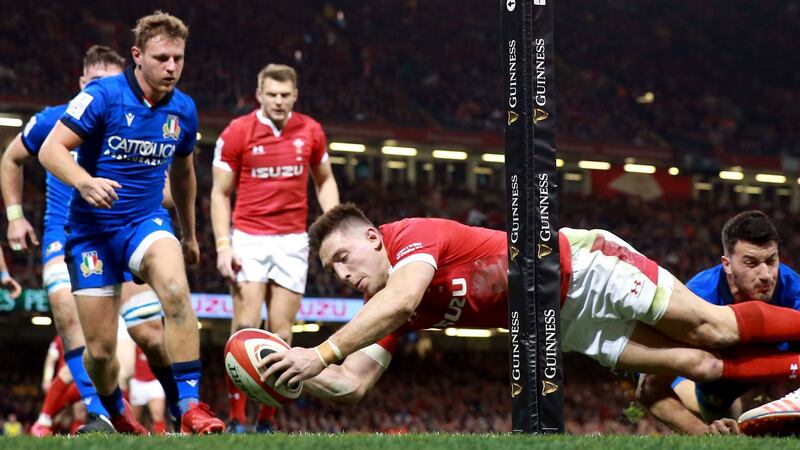 Josh Adams dives to score one of his brace of tries against Italy. Photograph: Adam Davy/PA