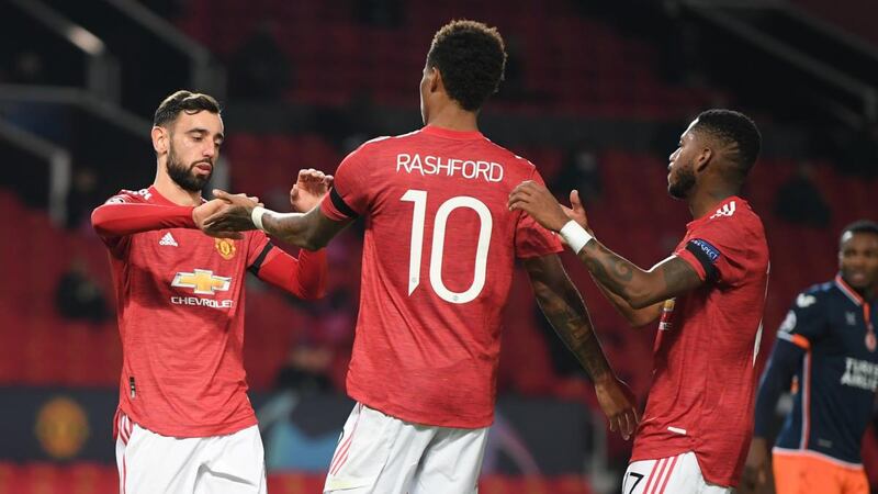 Bruno Fernandes congratulates Marcus Rashford after his penalty against Istanbul Basaksehir. Photograph:  Michael Regan/Getty