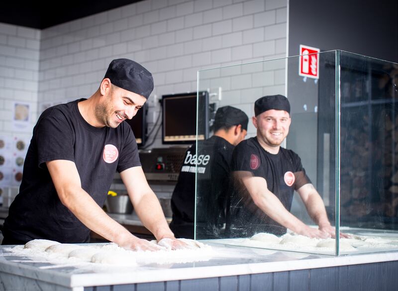 Staff working at Base Wood Fired Pizza. The group appears to be highly profitable. It doesn’t publish consolidated accounts, but various recent financial statements suggest that five of its outlets – Terenure, Stillorgan, Lucan, Glenageary and Ballsbridge – racked up profits of close to €900,000 last year between them.