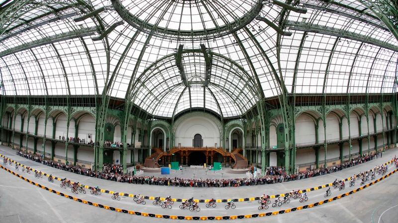 The pack rides inside the Grand Palais in Paris final stage of the Tour de France on Sunday. Photograph: Francois Guillot/AFP/Getty Images