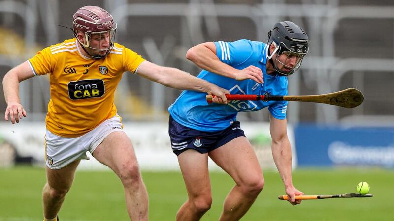 Dublin’s Donal Burke in action against  Antrim’s Eoghan Campbell during the game in Navan. Photograph: John McVitty/Inpho