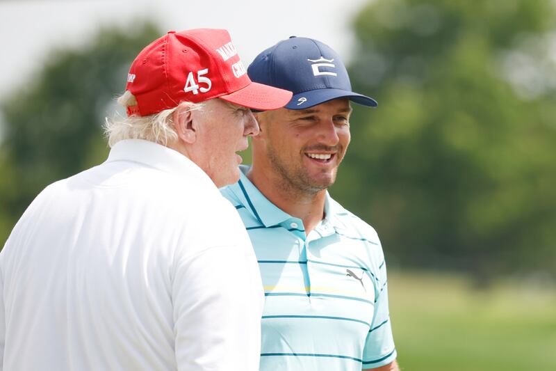 Donald Trump with Bryson DeChambeau, who may be visiting the Phoenix Park before this month's Open Championship. Photograph: Cliff Hawkins/Getty Images