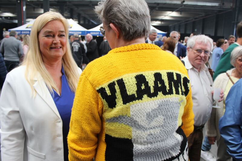 Vlaams Belang supporter Machteld Fitters with a hand-knitted party jumper at a campaign rally in Antwerp. Photograph: Jack Power
