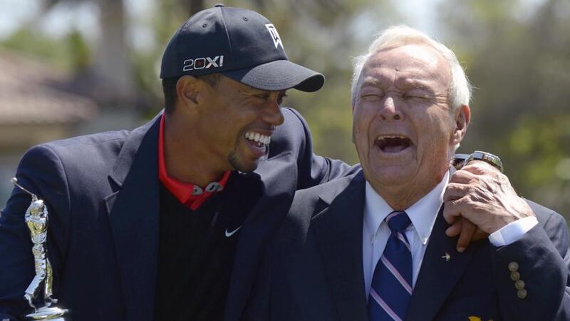 Tiger Woods and Arnold Palmer share a joke during the trophy presentation after Woods won the Arnold Palmer Invitational at Bay Hill. Photograph: Phelan M Ebenhack/AP