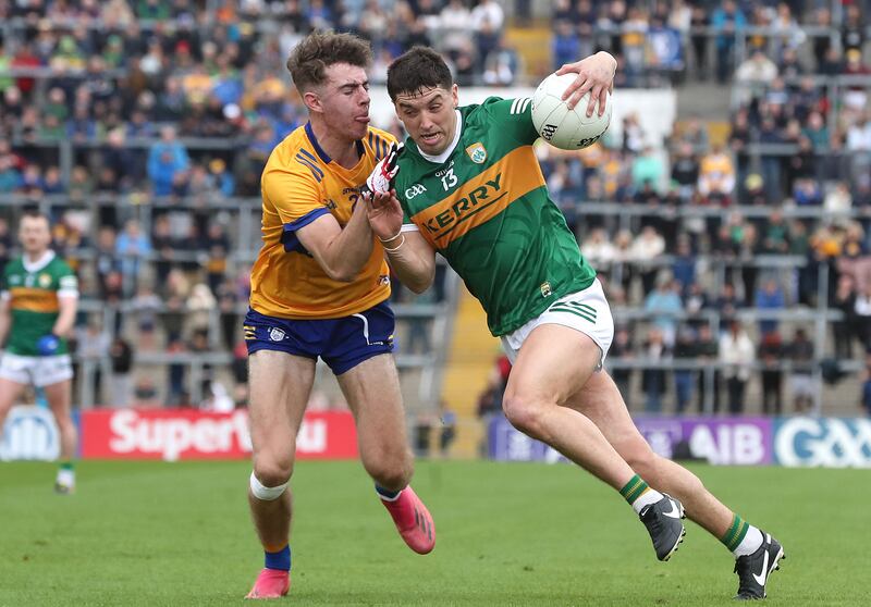 Tony Brosnan (right) clashes with Manus Doherty during the final of the Munster SFC on Sunday. Photograph: Bryan Keane/Inpho