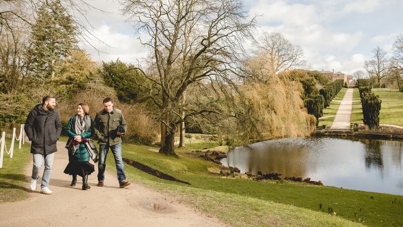 Restaurateur Keelan Higgs takes a stroll around Hillsborough Castle and Gardens with Armagh country house hotel owners Louise and John Mathers. Photograph: Declan Devlin