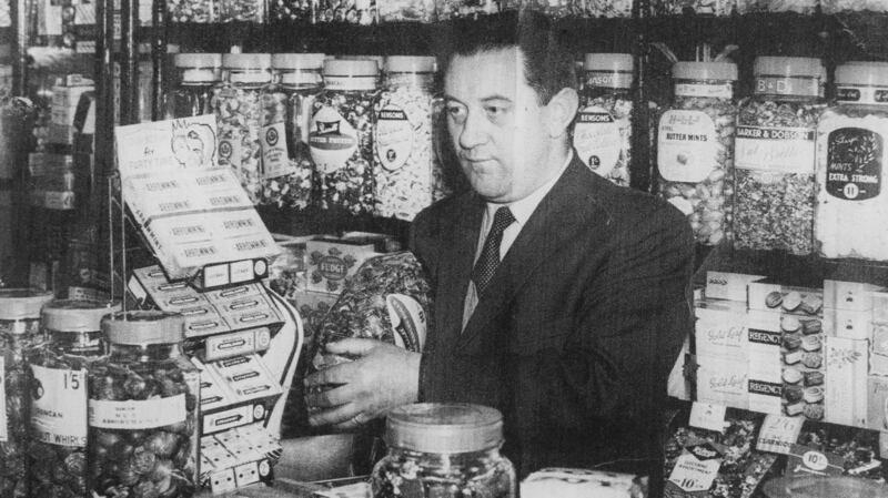 Henry Liddy in the newsagent’s and confectionery shop he ran with his wife Mairead Liddy in Belfast