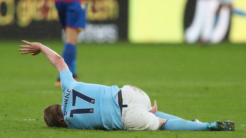 Kevin De Bruyne was stretchered off in the closing stages of Man City’s draw with Crystal Palace. Photograph: Catherine Ivill/Getty