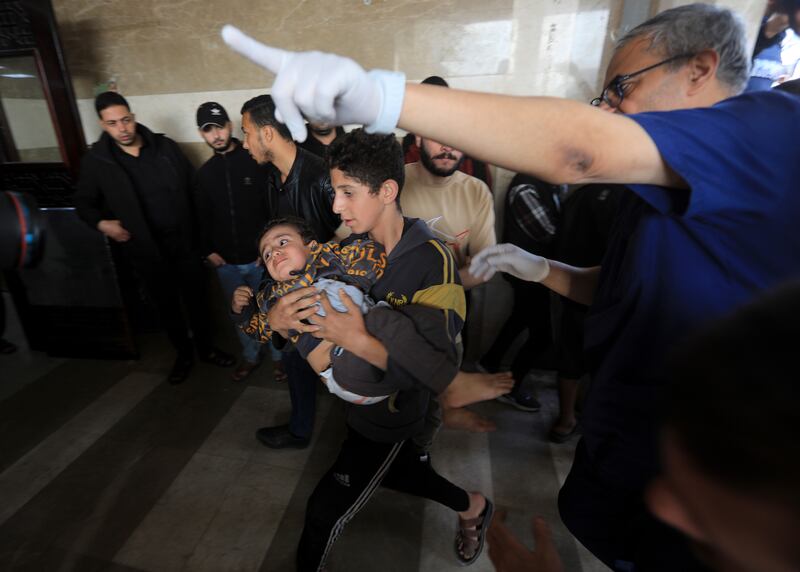 Injured Palestinians arriving at Nasser Medical Hospital in Khan Younis, south Gaza, after the end of the temporary ceasefire between Hamas and Israel. Photograph: Yousef Masoud/The New York Times
                      