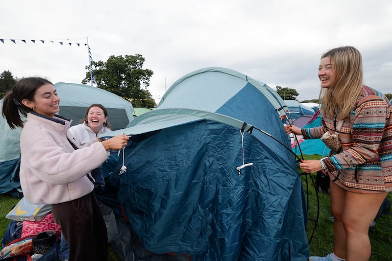 Electric Picnic 2025: Ellie Diamond, Aoife Dolan and Ruth McCormack from Belfast, Mayo and Kildare set up their tent. Photograph: Alan Betson
