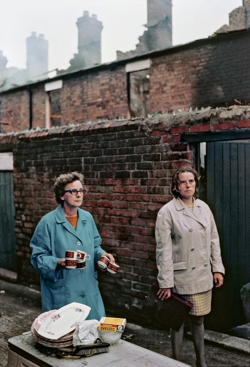 Local women stand near their burned out homes on Bombay Street, west Belfast in 1969.