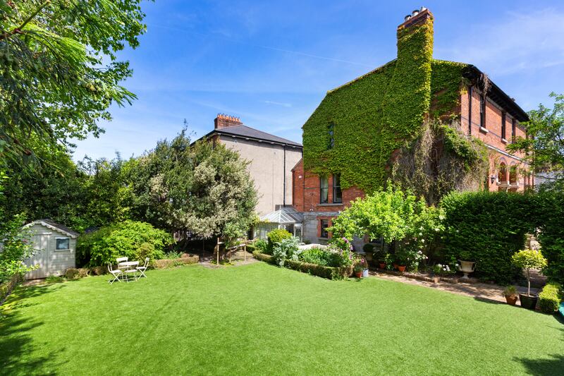 Sheltered by high box hedging and plenty of tall trees, the garden has its own access gate to Leeson Park, while another security gate leads to the front of the house.