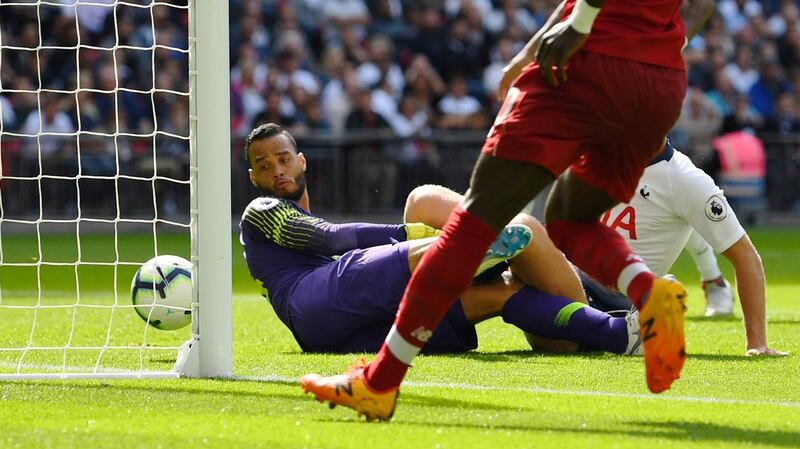 Michel Vorm looks on as Roberto Firmino scores Liverpool’s second against Spurs. Photograph: Dylan Martinez/Reuterst
