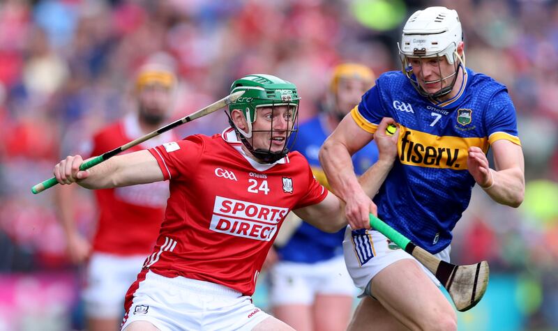 Cork’s Robbie O'Flynn is challenged by Bryan O'Mara of Tipperary during the Munster SHC game at Páirc Uí Chaoimh. Photograph: James Crombie/Inpho