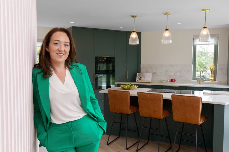 Pharmacist Sarah in her renovated bungalow on the final episode of Bungalow Bliss with Hugh Wallace. He helps Sarah to restore the home she grew up in 50 years after her grandparents bought it off a design in a book.
