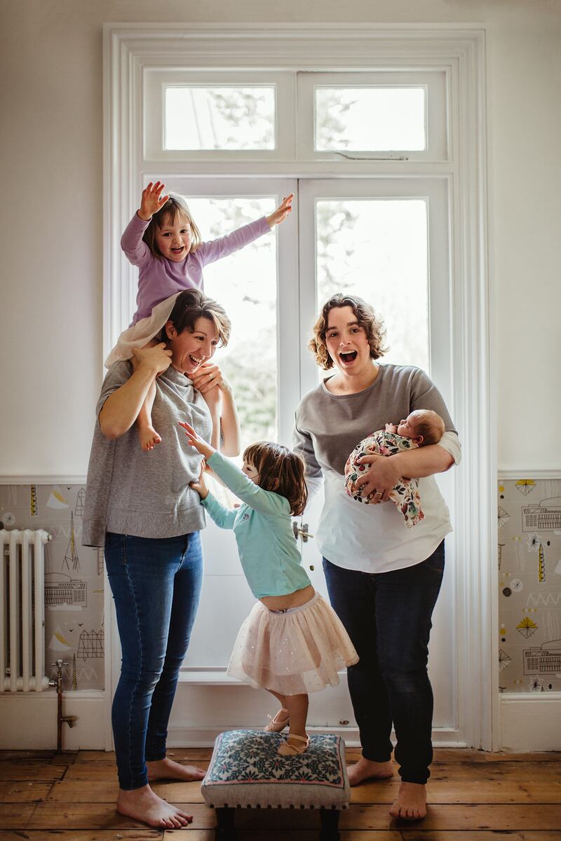 Claire Lynch (left) with her wife, Bethan, and their children