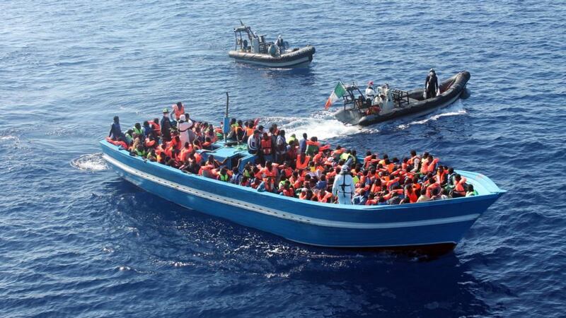 Crew of the Irish Navy vessel LÉ Éithne rescue refugees in the Mediterranean. Photograph: David Jones/Irish Defence Forces/PA Wire