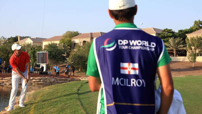 McIlroy plays his shot from the rocks at the 17th. Photo: Andrew Redington/Getty Images