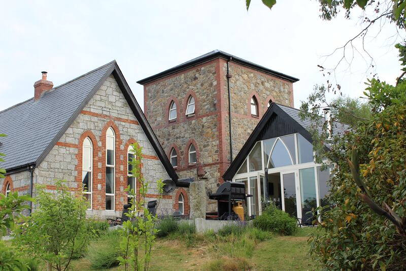Additions to the property  include a tower and a sun room 