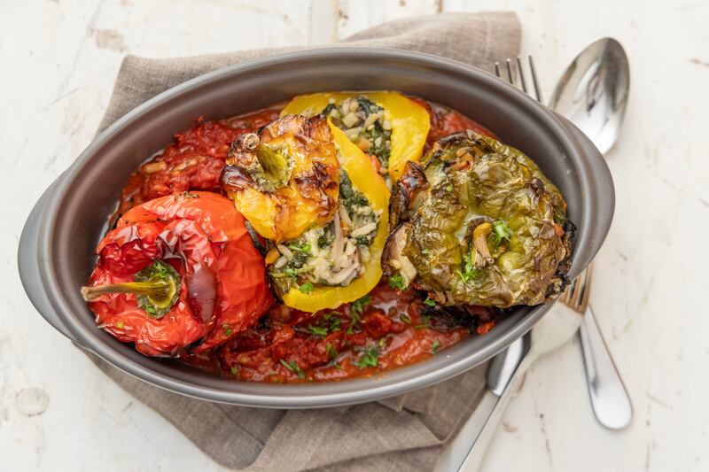 Spinach and mushroom stuffed bell peppers in a tomato and tarragon sauce. Photograph: Harry Weir Photography