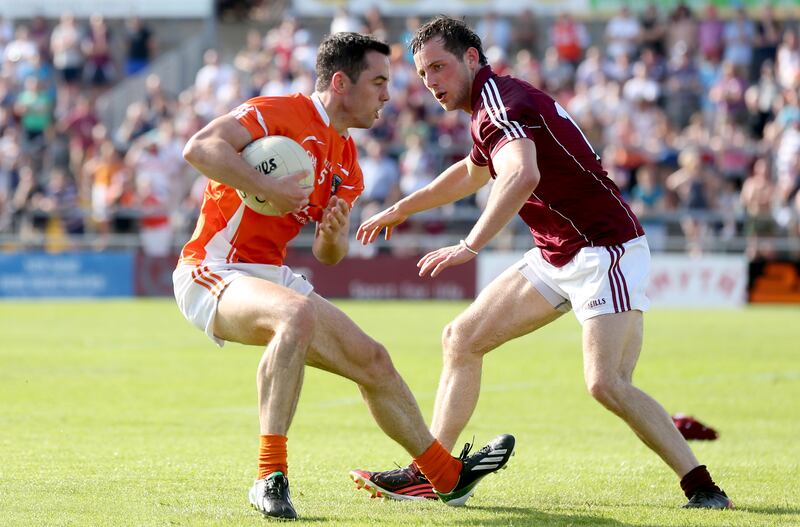 Armagh's Aaron Kernan comes under pressure from Galway's John O'Brien in 2013. Photograph: James Crombie/Inpho