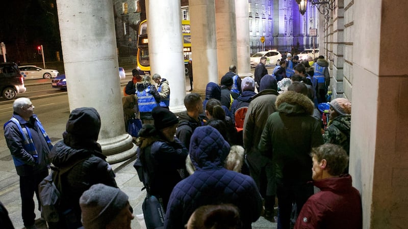 The homeless queue for food from Feed Our Homeless at College Green in Dublin. Photograph: Damien Eagers
