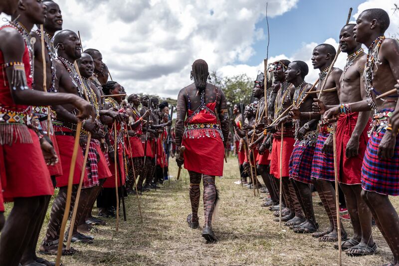 A group of Maasai men march while dancing traditional songs during a Maasai cultural festival in Sekenani, in June 2023. Photograph: Luis Tato/AFP/Getty Images