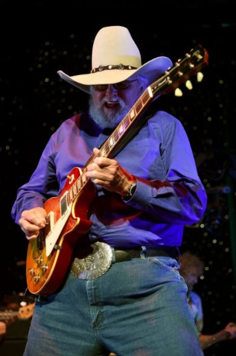 Daniels’ band used dual lead guitarists and dual drummers in the service of an expansive improvisational sound that included elements of country, blues, bluegrass, rock and Western swing. Here he performs in Atlanta, Georgia in 2014. Photograph: Mike Coppola/Getty Images