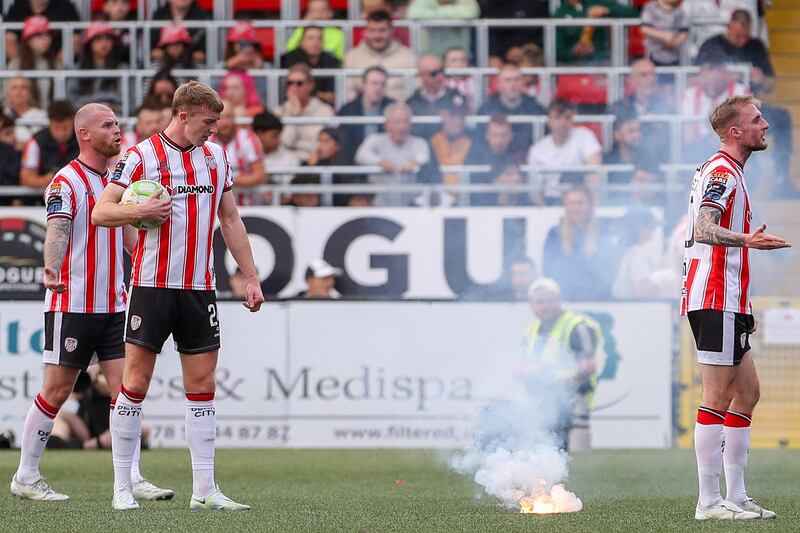 Play stops at the Brandwell after a flare is thrown onto the pitch. Photograph: Lorcan Doherty/Inpho