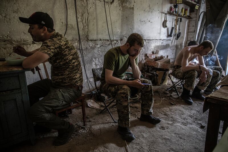 Ukrainian soldiers from the 95th Air Assault Brigade take a break in the region of Donetsk, Ukraine on June 3rd