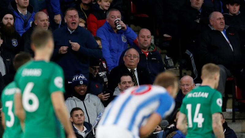 James McClean: an angry fan points to his chest as he shouts at the Irish winger for not wearing a poppy during West Bromwich Albion’s match against Huddersfield. Photograph: Ed Sykes/Reuters