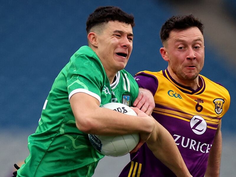 Limerick’s Emmett Rigter in action against Wexford's Eoghan Nolan. Photograph: Ryan Byrne/Inpho