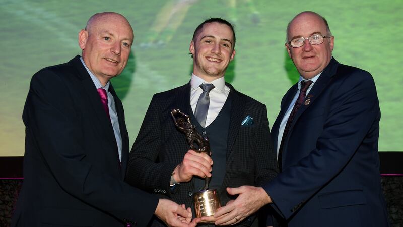 Kieran Molloy of Corofin is presented with his club footballer of the year award by  GAA president John Horan (right) and Denis O’Callaghan, head of AIB Retail Banking, at Croke Park on Saturday night. Photograph: Stephen McCarthy/Sportsfile