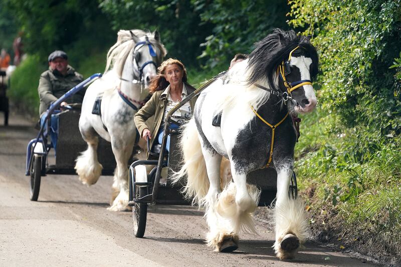 People in horse-drawn carriages during the Appleby Horse Fair. Photograph: Owen Humphreys/PA