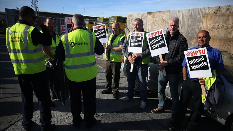 Dublin Bus workers outside the Broadstone Bus depot in Dublin. Photograph: Brian Lawless/PA Wire