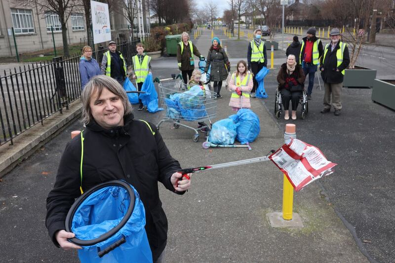 Trevor Clowry with other volunteers from Crumlin Community Cleanup, working at the weekend on Armagh Road, Crumlin, Co Dublin. Photograph: Dara Mac Dónaill