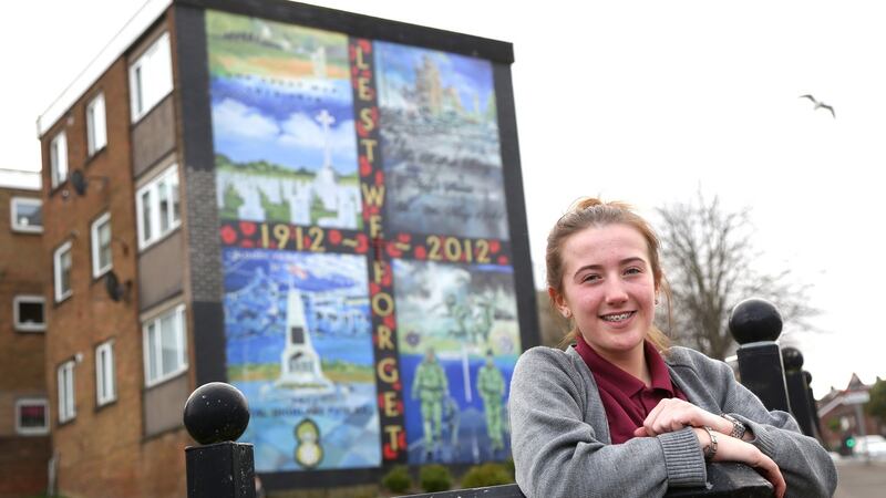 Chloe Dickson in front of the mural which she helped to design in the Ballysillan estate in north Belfast. Photograph: Stephen Davison/Pacemaker