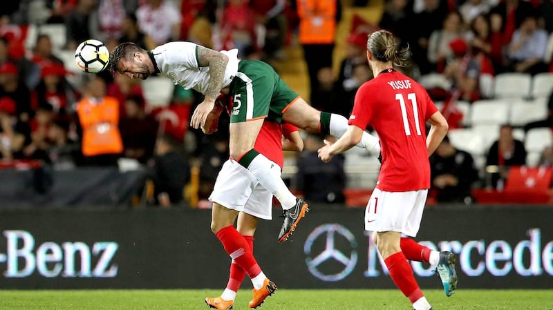 Republic of Ireland defender Shane Duffy gets above Turkey’s Cenk Tosun to head the ball during the friendly international at the Antalya Stadyumu. Photograph: Ryan Byrne/Inpho
