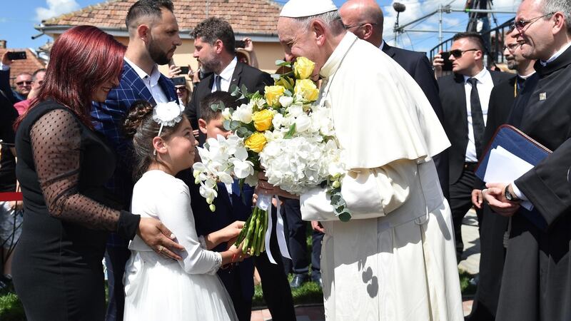 Pope Francis meets members of the Roma community in the Barbu Lautaru district of Blaj, Romania, on Sunday. The pope  is on a three-day visit to Romania.  Photograph: Andreas Solaro/EPA