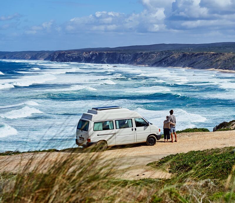 Sina Schubert and Carsten Konsen take in a beautiful seascape in Portugal. Photograph: Sian Richards