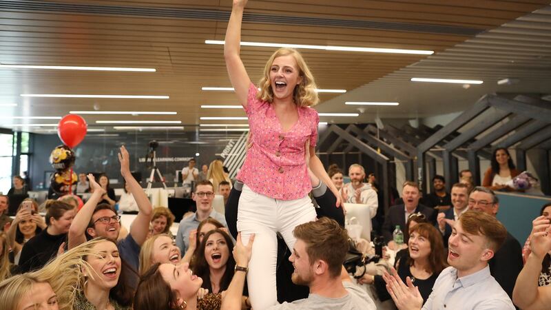 Medical students at Royal College of Surgeons in Ireland get their final results  and lift their classmate,  former Rose of Tralee and top-place student, Dr Elysha Brennan into the air. Photograph: Julien Behal