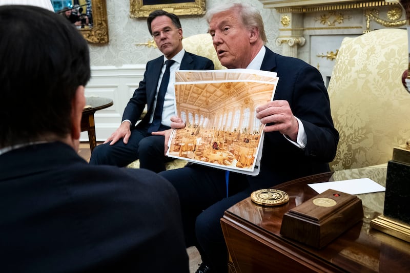 President Donald Trump holds a rendering of the new White House ballroom as meets with Nato's Mark Rutte in the Oval Office of the White House in Washington, on October 22nd. Photograph: Doug Mills/The New York Times
                      