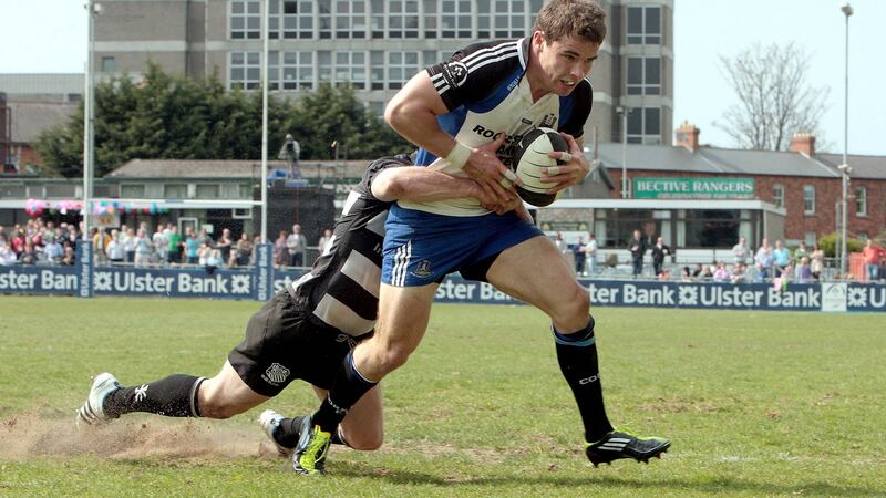 Scanlon scores a try for Cork Constitution in 2011 despite the attention of Old Belvedere’s Andy Dunne. Photo: Morgan Treacy/Inpho