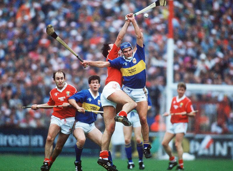 Martin Foley of Cork jumps with Tipperary's Conor Bonner during the 1991 Munster SHC final replay. Photograph: Inpho