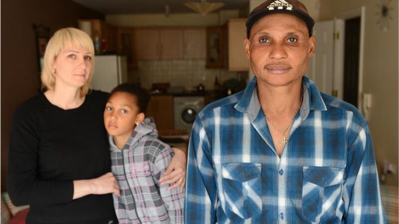 Tortured memories: Franky Nyakture with his wife, Larysa, and their daughter, Melysa. Photograph: Dara Mac Dónaill/The Irish Times