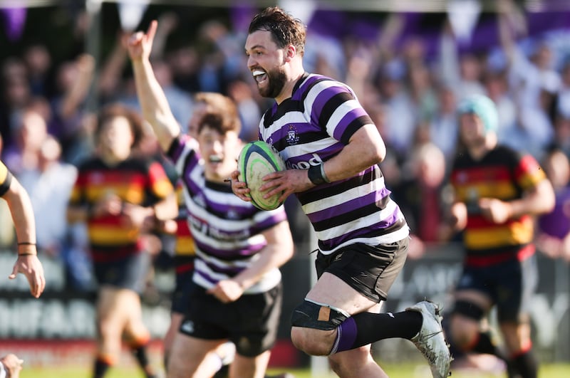 Terenure's Harrison Brewer makes a break on his way to scoring his side’s third try against Lansdowne last year. Photograph: Tom Maher/Inpho
