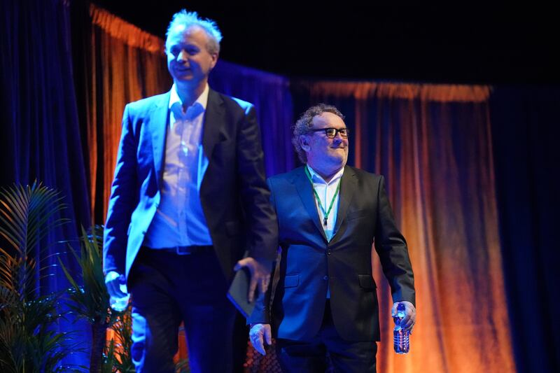 Radio presenter Matt Cooper (left) walks on stage with actor Colm Meaney during the event. Photograph: Niall Carson/PA