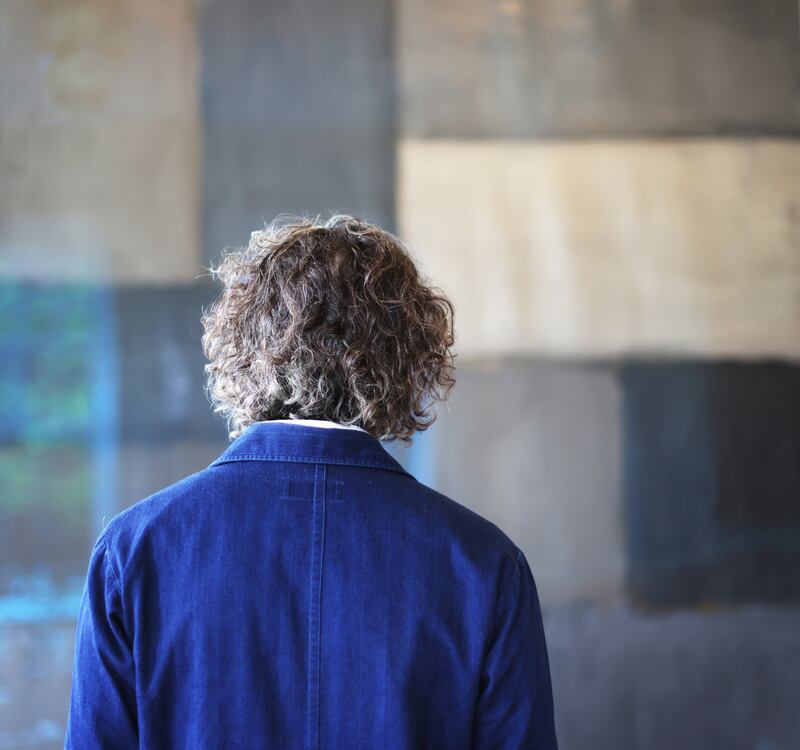 Bryan Meehan standing at one of his Sean Scully paintings, 'Moorland' 2007 which hangs in the hotel's dining room. Photos: Bryan O’Brien / The Irish Times 